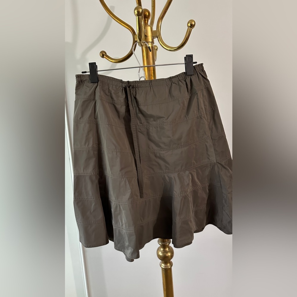 Navy green light skirt with adjustable waist.